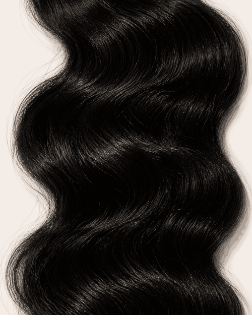 Close-up of natural color body wave curl pattern and texture