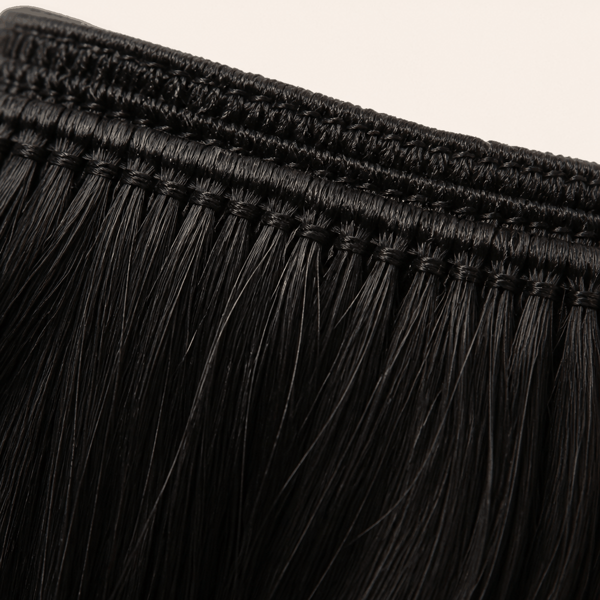 Machine weft detail on a body wave human hair bundle